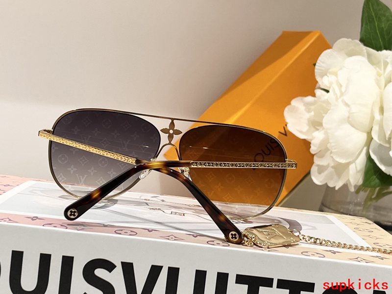 Close-up detail view of Louis Vuitton unisex sunglasses