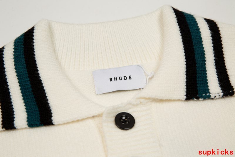 Close-up detail shot of Rhude luxury clothing with signature branding