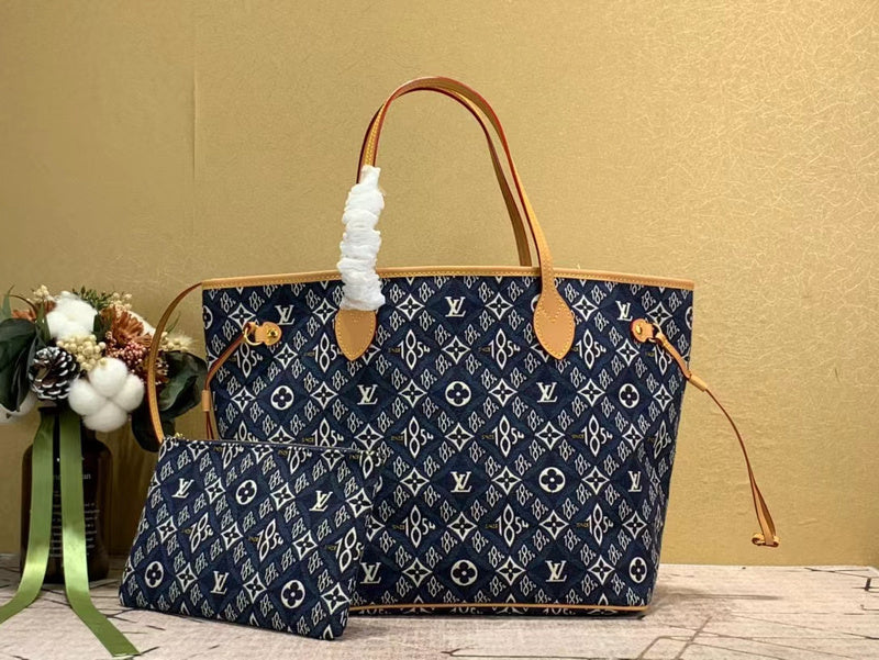 Side profile of sleek refined women's handbag – women's statement bag