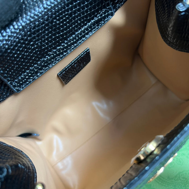 Close-up detail of statement premium women's handbag – women's luxury accessory