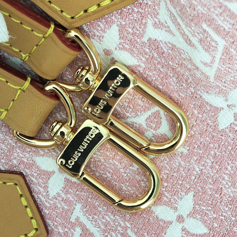 Handle and strap detail of modern signature women's handbag – women's statement bag