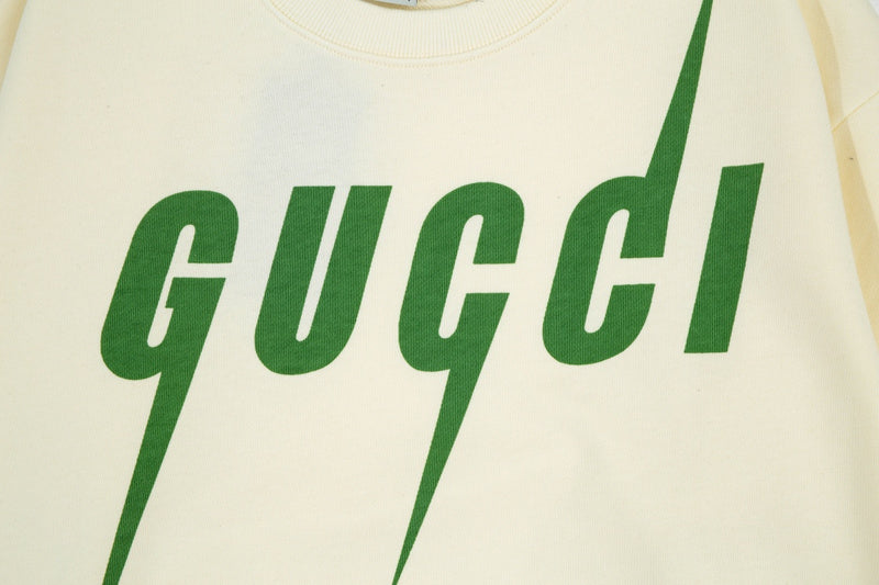 Flat lay presentation of Gucci luxury clothing with tailored silhouette
