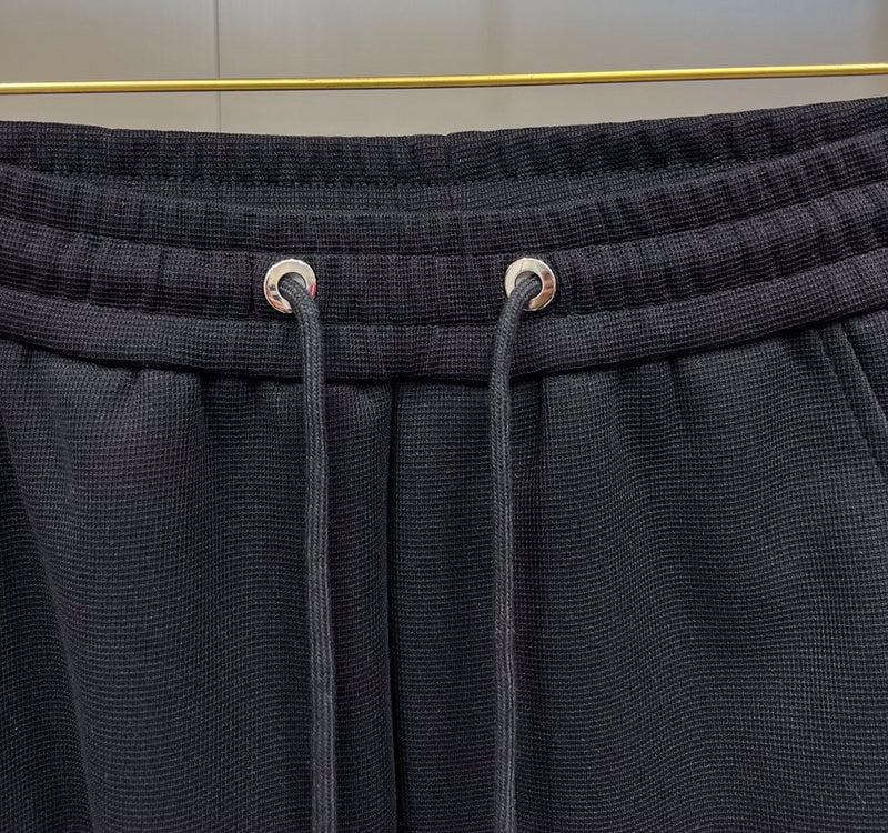 Close-up detail shot of Louis Vuitton luxury clothing with runway-inspired design