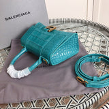Styled lifestyle shot of structured polished women's handbag – women's luxury accessory
