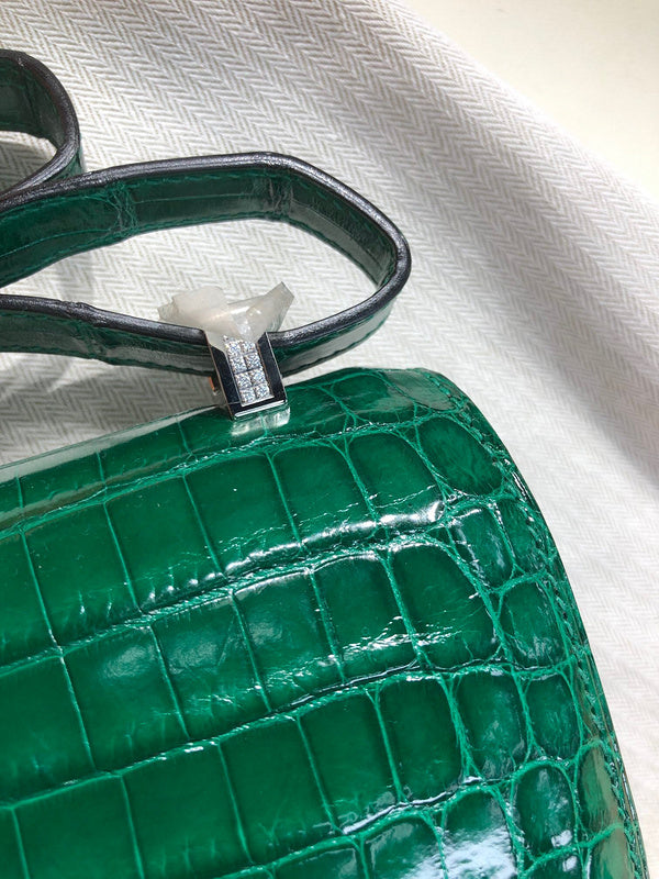 Side view of streamlined structured handbag