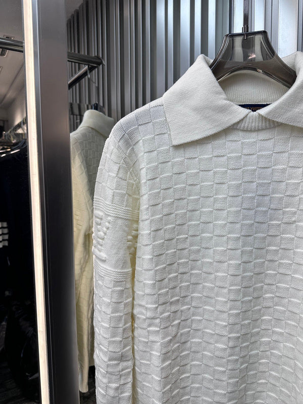 Close-up detail shot of Louis Vuitton luxury clothing with runway-inspired design