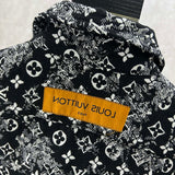 Close-up detail shot of Louis Vuitton luxury clothing with label-forward styling