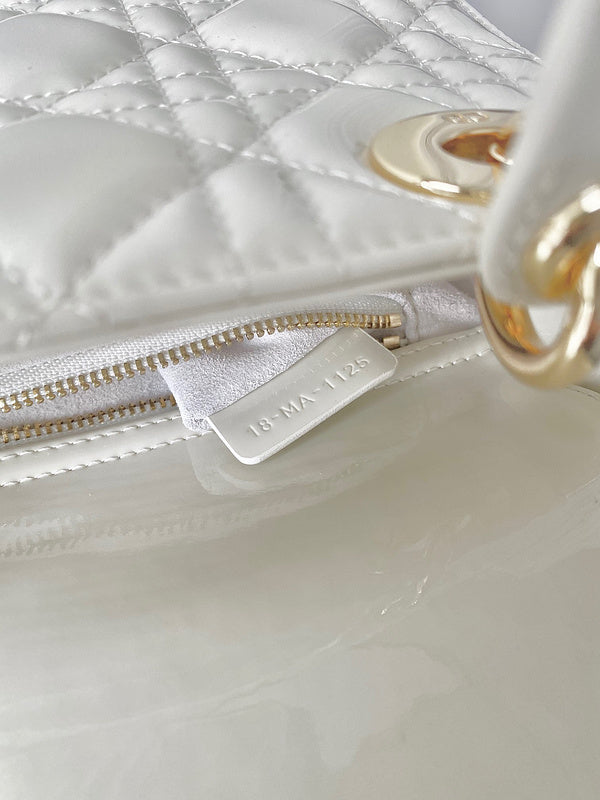 Styled lifestyle shot of structured signature women's handbag – women's designer-style accessory