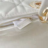 Styled lifestyle shot of structured signature women's handbag – women's designer-style accessory