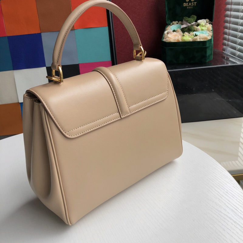 Handle and strap detail of signature classic women's handbag – women's designer-style accessory