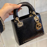 Styled lifestyle shot of everyday-luxe structured women's handbag – women's everyday handbag