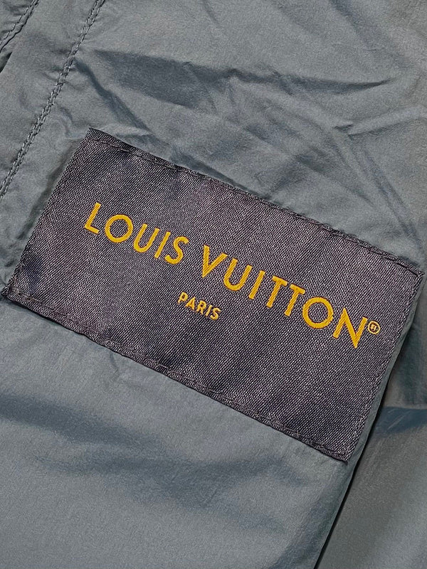 Close-up detail shot of Louis Vuitton luxury clothing with logo-detail design