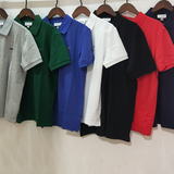 Side profile of Lacoste luxury clothing with signature branding