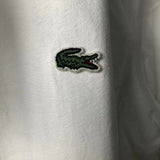 Flat lay presentation of Lacoste luxury clothing with monogram-inspired silhouette