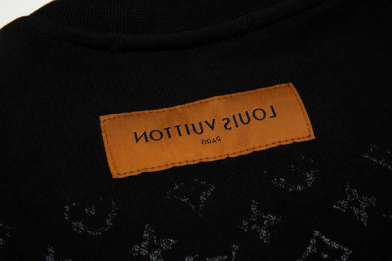 Side profile of Louis Vuitton luxury clothing with signature branding