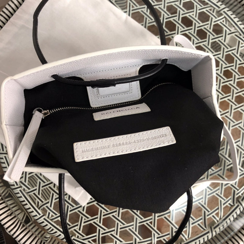 Side profile of structured statement women's handbag – women's luxury handbag