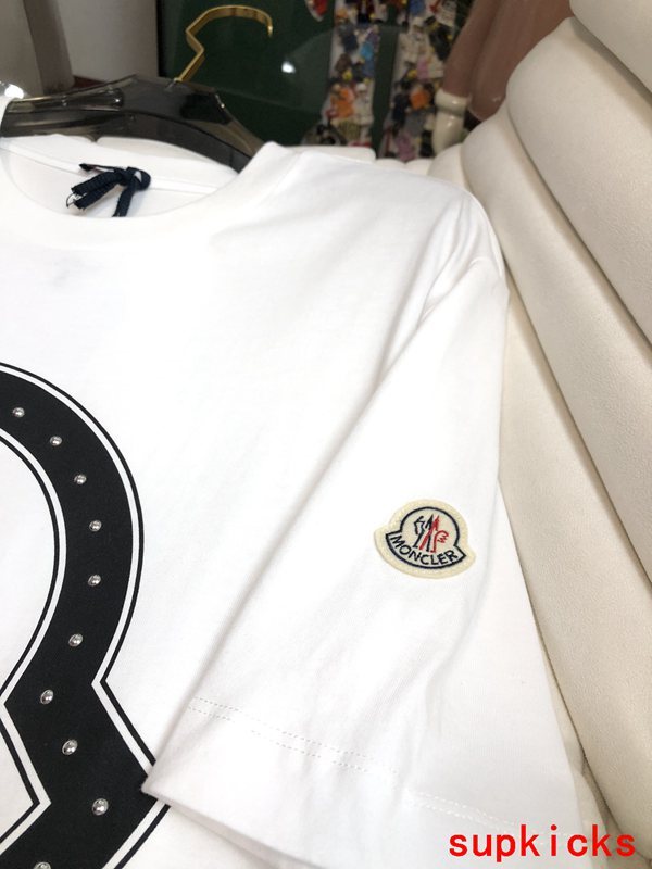 Side profile of Moncler luxury clothing with monogram-inspired silhouette