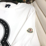 Side profile of Moncler luxury clothing with monogram-inspired silhouette