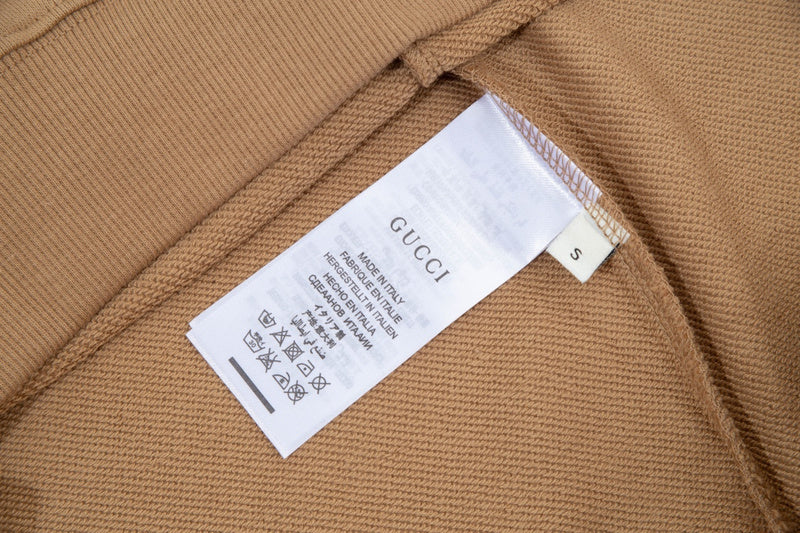 Close-up detail shot of Gucci luxury clothing with contemporary cut