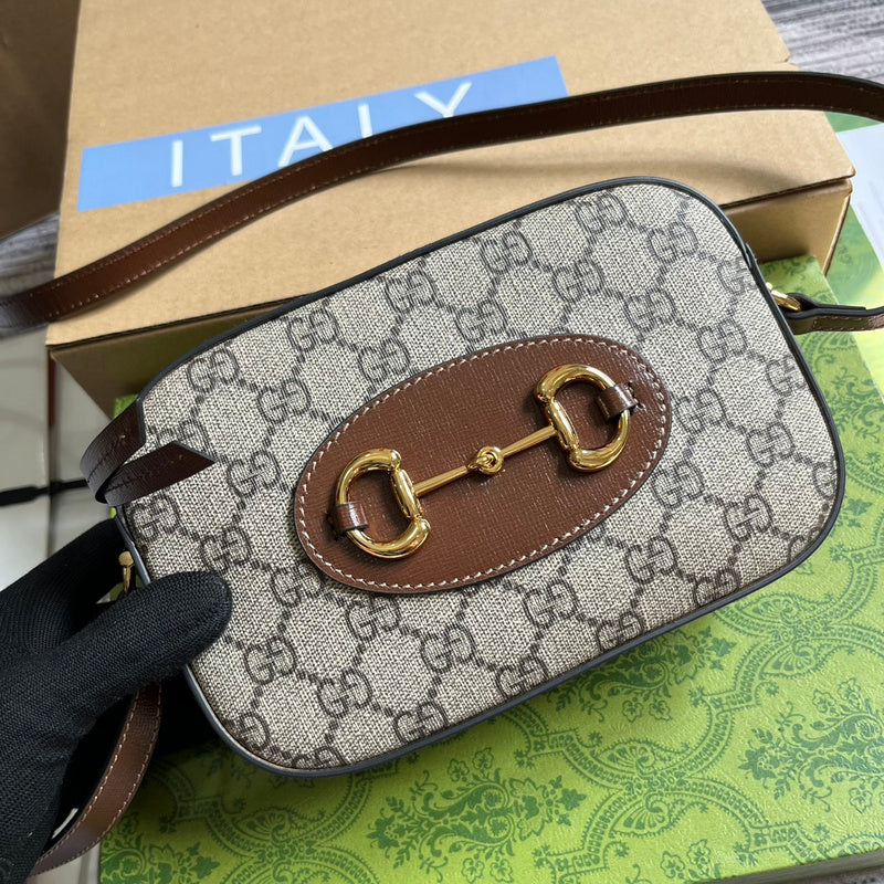 Styled lifestyle shot of classic signature women's handbag – women's luxury handbag