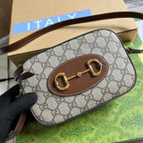 Styled lifestyle shot of classic signature women's handbag – women's luxury handbag