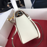 Handle and strap detail of statement structured women's handbag – women's luxury accessory