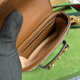 Side profile of sleek polished women's handbag – women's designer-style accessory