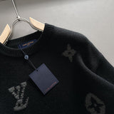 Close-up detail shot of Louis Vuitton luxury clothing with signature branding