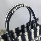 Styled lifestyle shot of modern statement women's handbag – women's luxury accessory