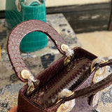 Handle and strap detail of polished sleek women's handbag – women's premium purse