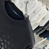 Flat lay presentation of Louis Vuitton luxury clothing with contemporary cut