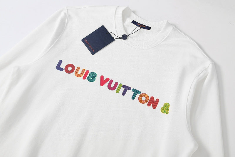Flat lay presentation of Louis Vuitton luxury clothing with signature branding