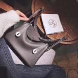 Side view of refined structured handbag