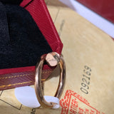Side view of Cartier unisex jewelry piece