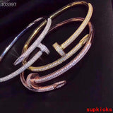 Close-up detail view of Cartier unisex jewelry piece