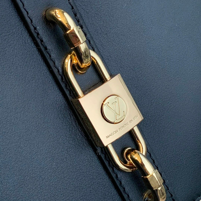 Styled lifestyle shot of chic sleek women's handbag – women's luxury accessory