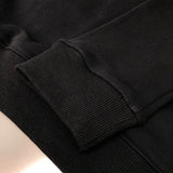 Flat lay presentation of Louis Vuitton luxury clothing with signature branding