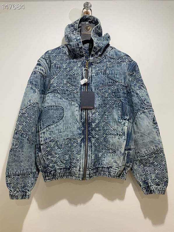 Close-up detail shot of Louis Vuitton luxury clothing with signature branding
