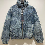 Close-up detail shot of Louis Vuitton luxury clothing with signature branding