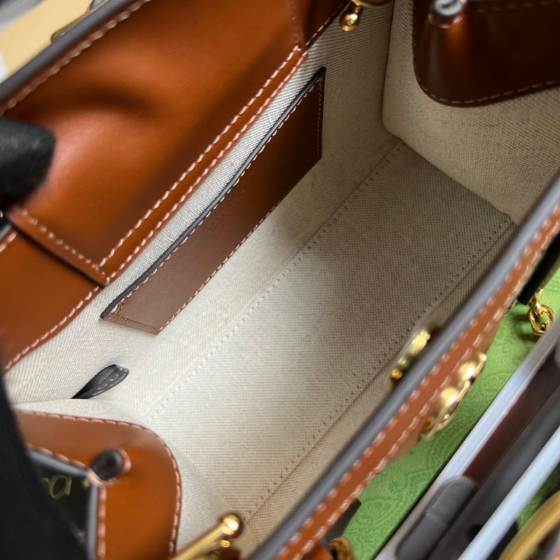 Handle and strap detail of statement classic women's handbag – women's luxury handbag