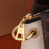  clean-lined top-handle bag styled with outfit