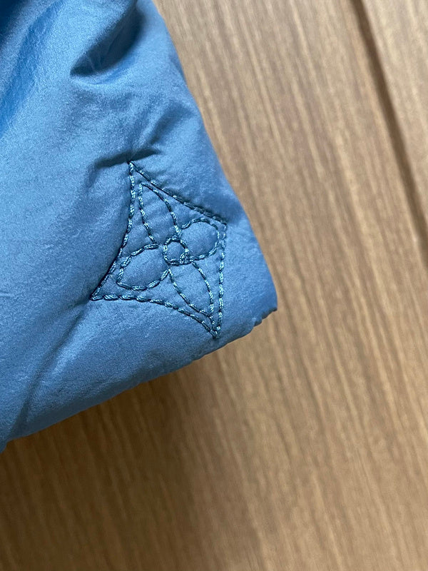 Front view of Louis Vuitton luxury clothing with logo-detail design