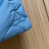 Front view of Louis Vuitton luxury clothing with logo-detail design