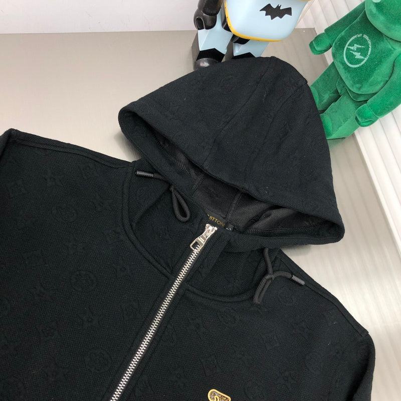 Close-up detail shot of Louis Vuitton luxury clothing with signature branding