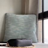  Refined crossbody bag carried on shoulder