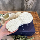 Gucci two-tone luxury sneakers view 4 signature lace-up style
