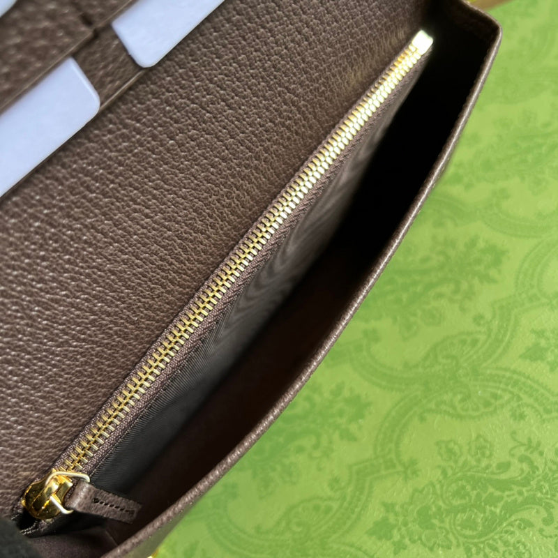 Side profile of chic polished women's handbag – women's statement bag