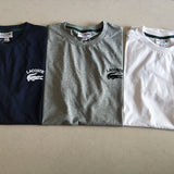 Side profile of Lacoste luxury clothing with signature branding