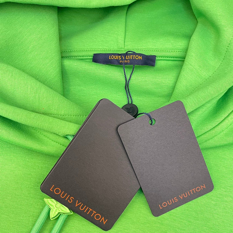Flat lay presentation of Louis Vuitton luxury clothing with tailored silhouette