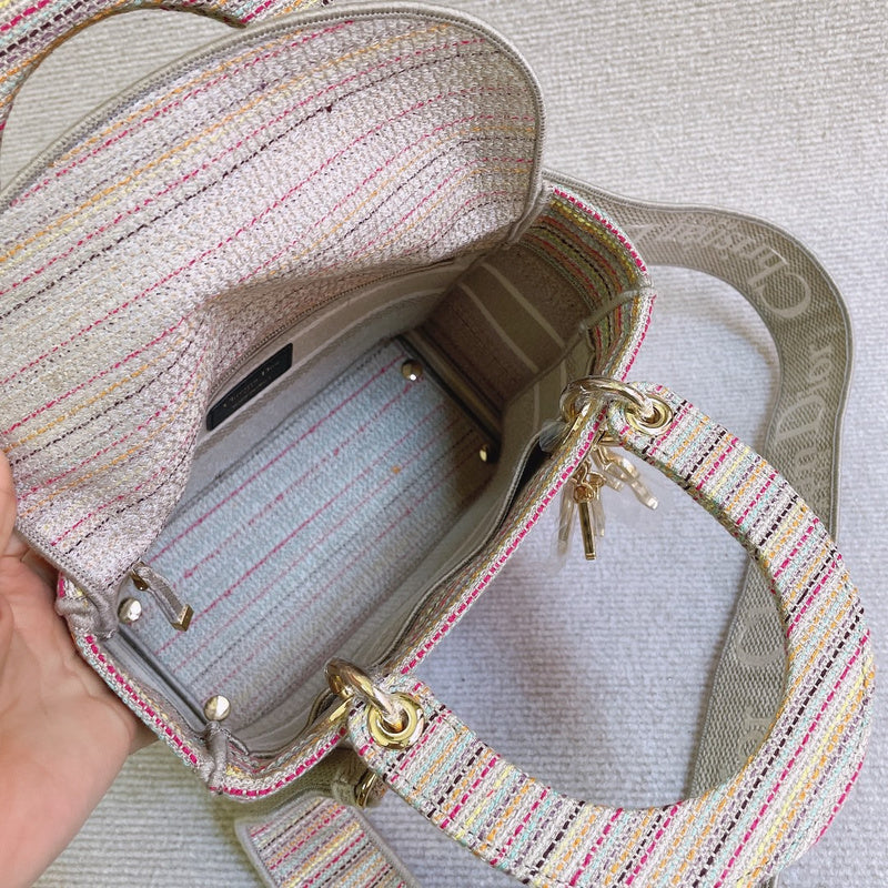 Handle and strap detail of polished classic women's handbag – women's luxury accessory